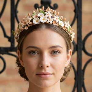 Front view of a bridal tiara inspired by antique French wax crowns with hand-sculpted cold porcelain flowers.