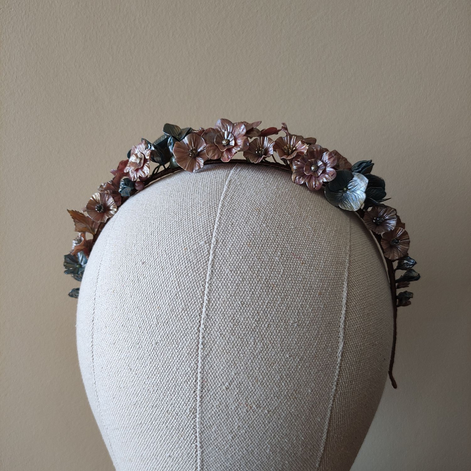 Cold porcelain metallic flower hairband with vibrant red and blue floral details and gold foliage.