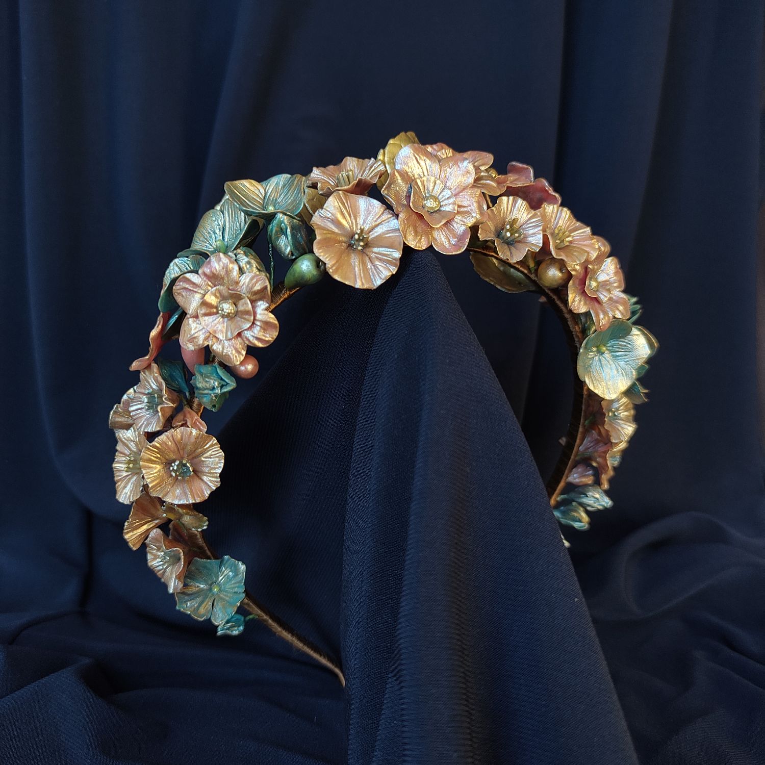 Handmade floral headband featuring metallic red and blue flowers sculpted from cold porcelain.